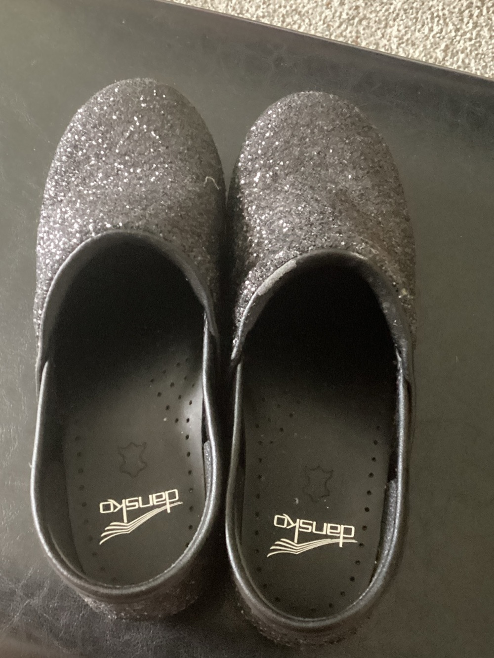 Dansko Women’s Black Glitter Clogs